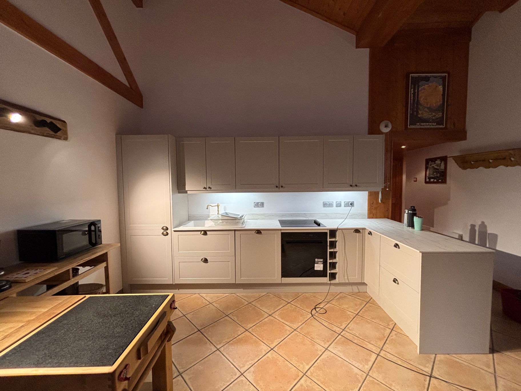 Newly fitted chalet kitchen with exposed timber beams
